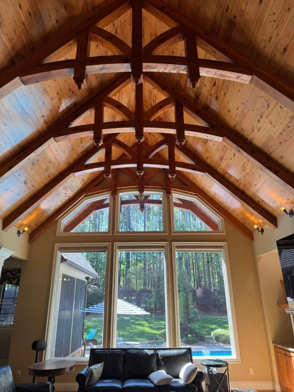Vaulted great room with painted walls and a stained tongue-and-groove timber ceiling